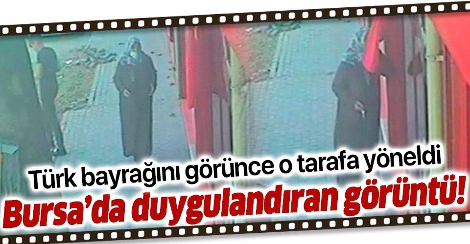 Bursa'da Türk bayrağını 3 kere öperek alnına koyan kadın görenleri duygulandırdı