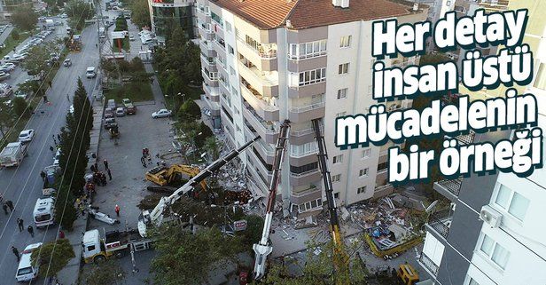 İzmir Bayraklı'da yan yatan bina 3 vinçle desteklenerek arama kurtarma çalışmaları yapılıyor